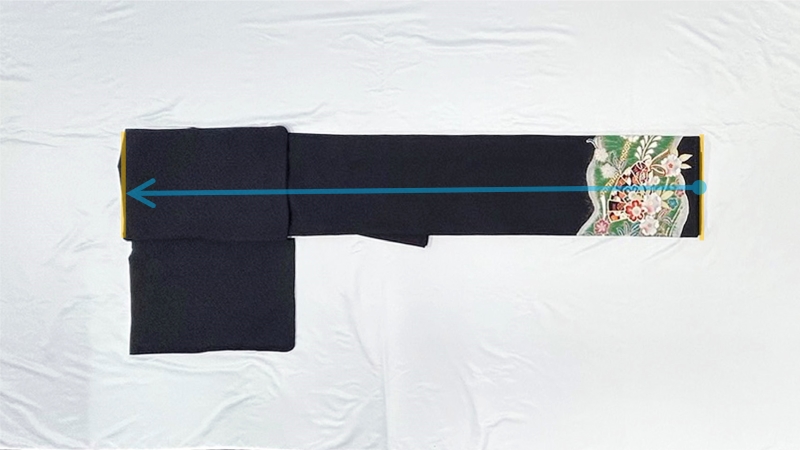 手順9 裾が首側に来るよう半分に折る